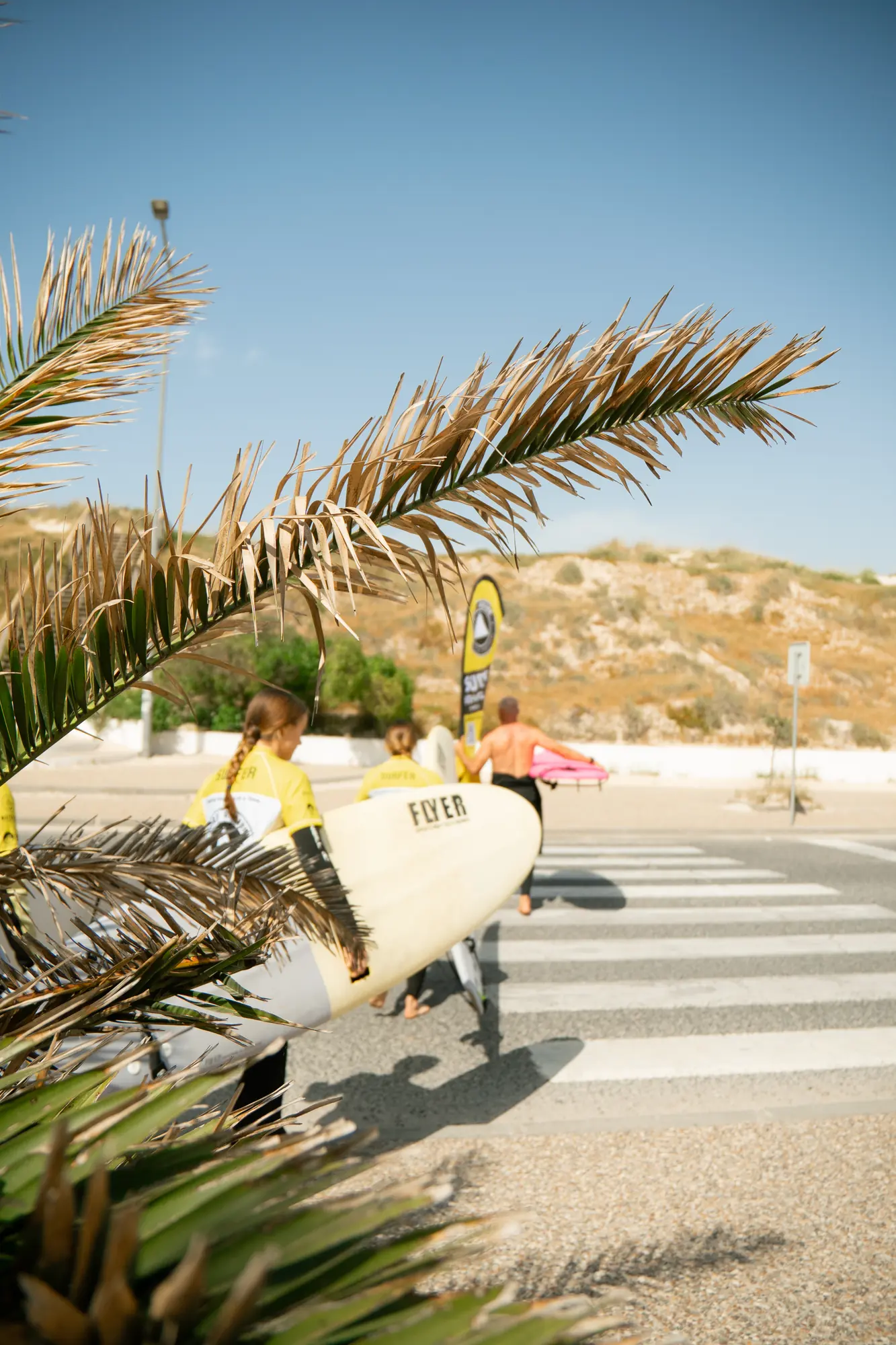 Surf students heading out for a lesson in Peniche