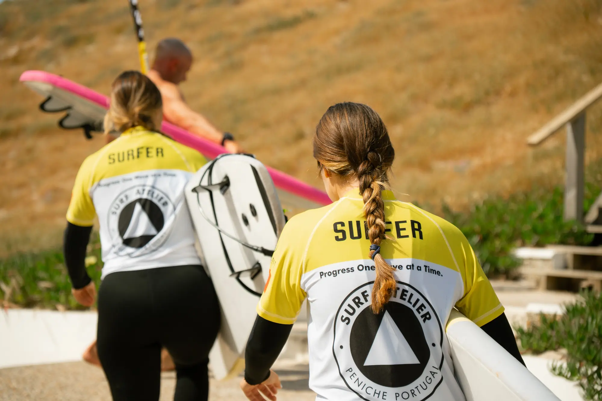 Surf Atelier students walking together with their boards