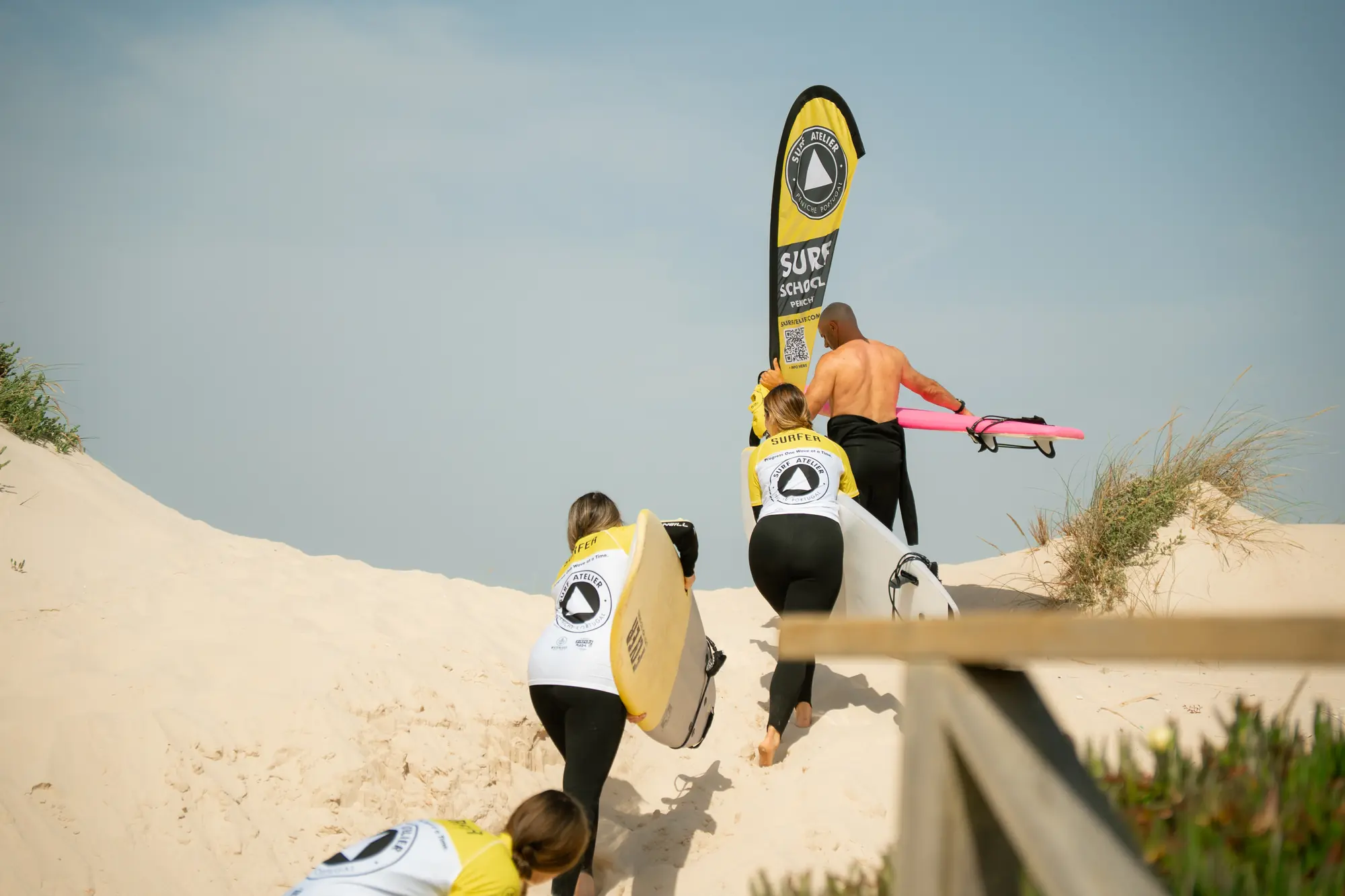 Surf class arriving at the beach with boards
