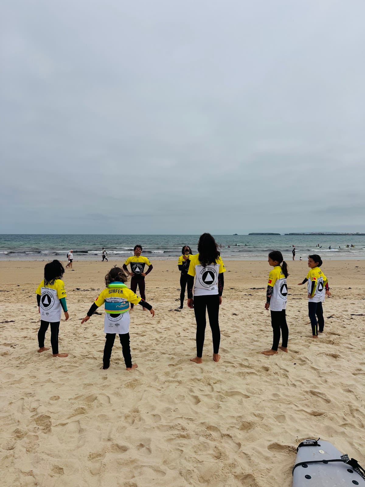 André and Rodrigo with students on the beach, from Joana Ribeiro's Google review